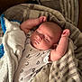 Warren is registered to the contest to win money with this photo: baby, bed, blanket, bodypart, couch, crib, cushion, face, finger, furniture, hand, head, infantbed, newborn, person, photography, portrait, quilt, sleeping, towel