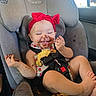 Autumn Faith is registered to the contest to win money with this photo: baby, child, car_seat, red_bow, chocolate, messy, food, smiling, happy, infant, seatbelt, car_interior, cute, face, hand, legs, foot, clothing, playful, snack