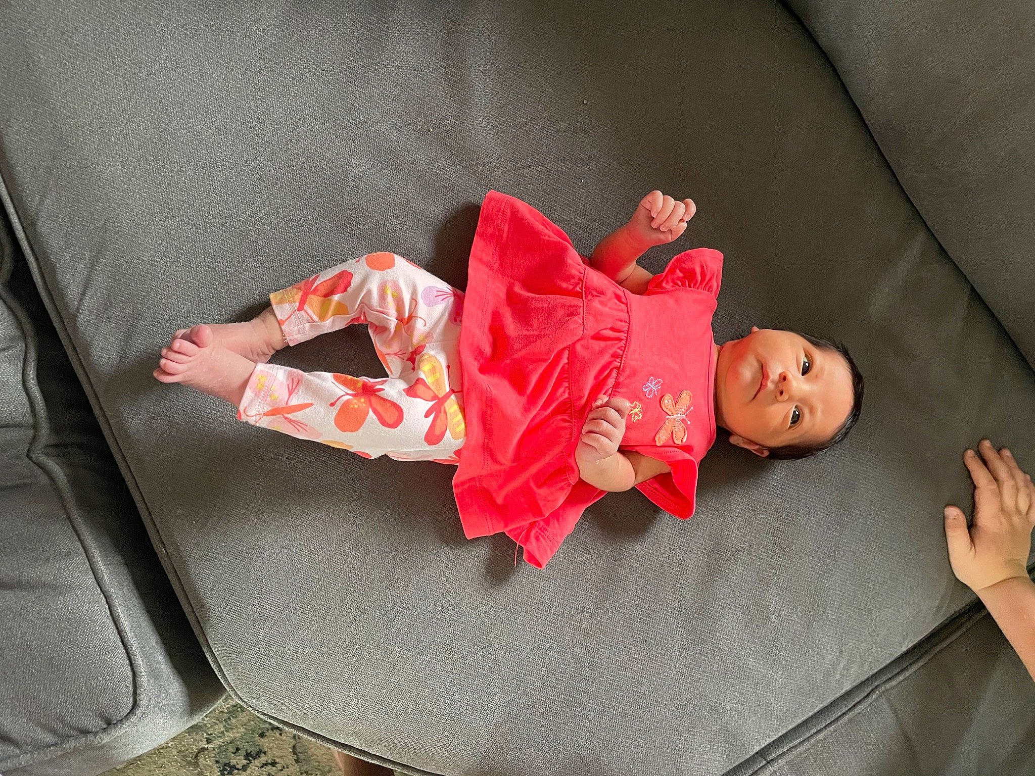 Amera is registered to the contest to win money with this photo: carmine, child, comfort, couch, doll, event, flooring, foot, human_leg, lap, leg, leisure, linens, magenta, person, room, sitting, sock, textile, thigh