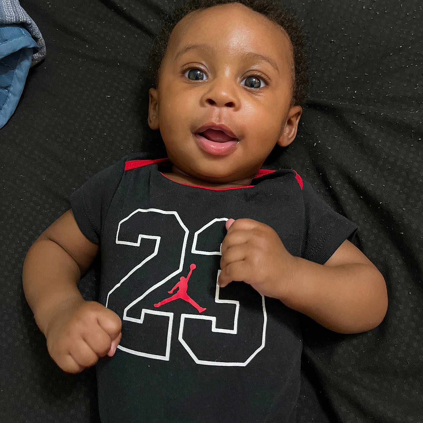 Makari joined the competition — help win amazing prizes! baby, bodypart, clothing, couch, face, finger, furniture, hand, happy, head, mouth, pants, person, photography, portrait, shirt, sleeve, smile, t_shirt, teeth