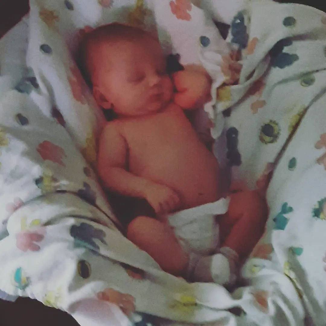 Crew is registered to the contest to win money with this photo: abdomen, baby, baby_products, bed, bedding, bedtime, child, comfort, flesh, foot, linens, pattern, person, room, thumb, toddler, white