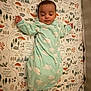 Jaxton is registered to the contest to win money with this photo: baby, sleeping, onesie, mint_green, sheep_pattern, mattress, patterned_bedding, peaceful, infant, child, sleep, cozy, cute, rest, fist, lying_down, indoor, soft_lighting, nursery, calm