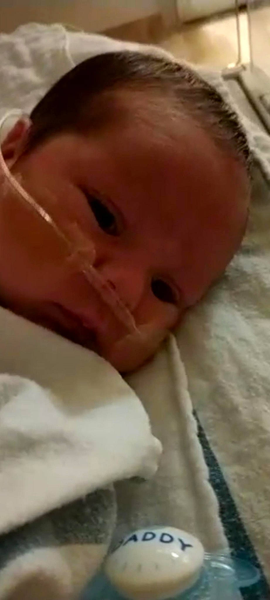 Nicholas is registered to the contest to win money with this photo: baby, baby_toddler_clothing, cheek, child, childbirth, close_up, comfort, ear, eyelash, flesh, iris, linens, nail, nose, person, skin, thumb, toddler