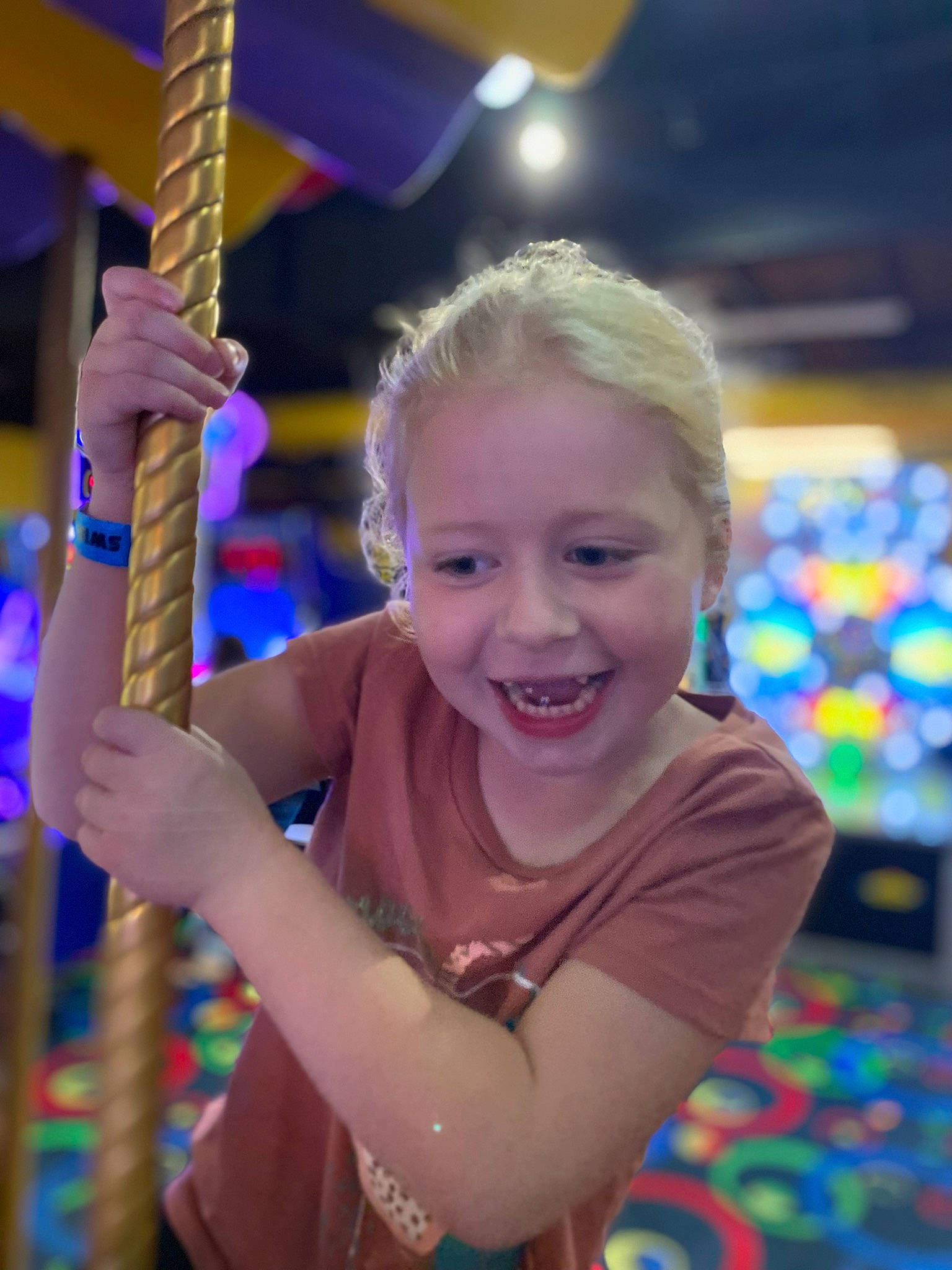 Audra is registered to the contest to win money with this photo: child, city, electric_blue, entertainment, event, fun, happy, joy, leisure, magenta, outdoor_play_equipment, party, person, play, playground, purple, recreation, smile, summer, swing