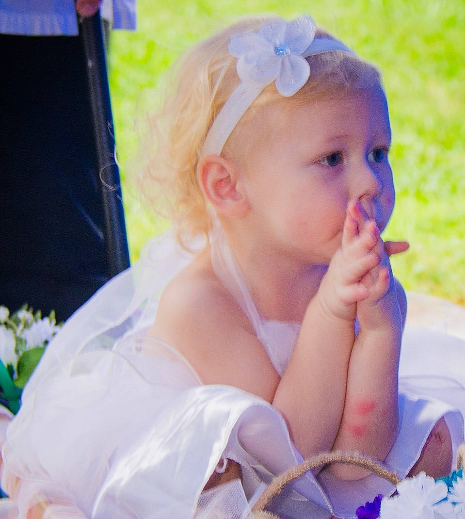 Audra is registered to the contest to win money with this photo: baby, child, dress, eye, fashion_accessory, finger, flower, hair_accessory, hand, headband, headgear, headpiece, lip, nose, person, pink, plant, product, skin, smile