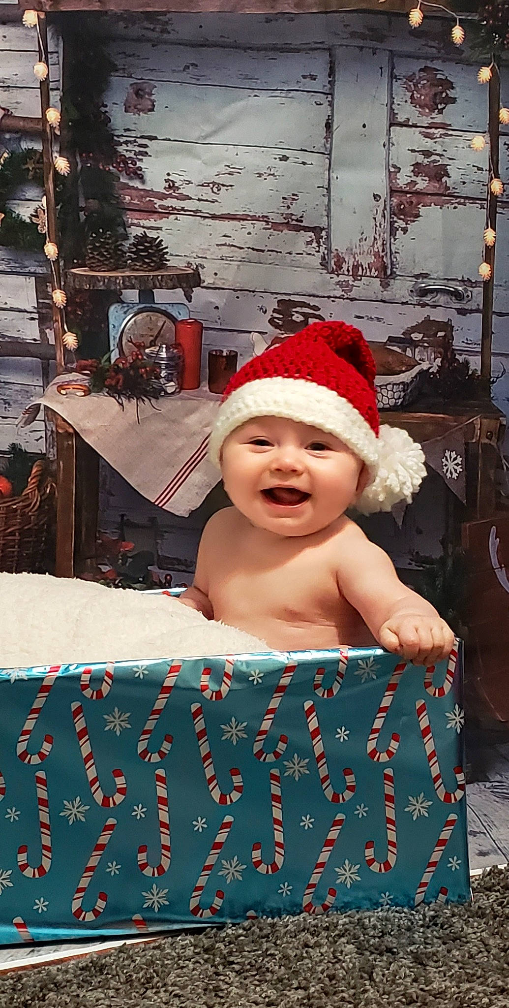 Anderson is registered to the contest to win money with this photo: art, baby, baby_toddler_clothing, cap, carmine, child, event, fictional_character, fun, happy, headgear, headwear, holiday, person, pink, red, room, santa_claus, smile, textile