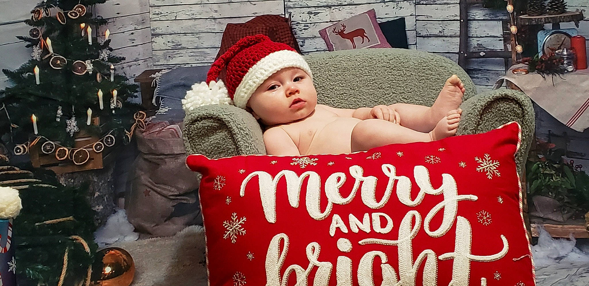 Anderson is registered to the contest to win money with this photo: baby, baby_sleeping, beauty, bedding, cap, child, comfort, event, font, fur, happy, headwear, holiday, linens, love, person, photo_caption, product, red, sitting