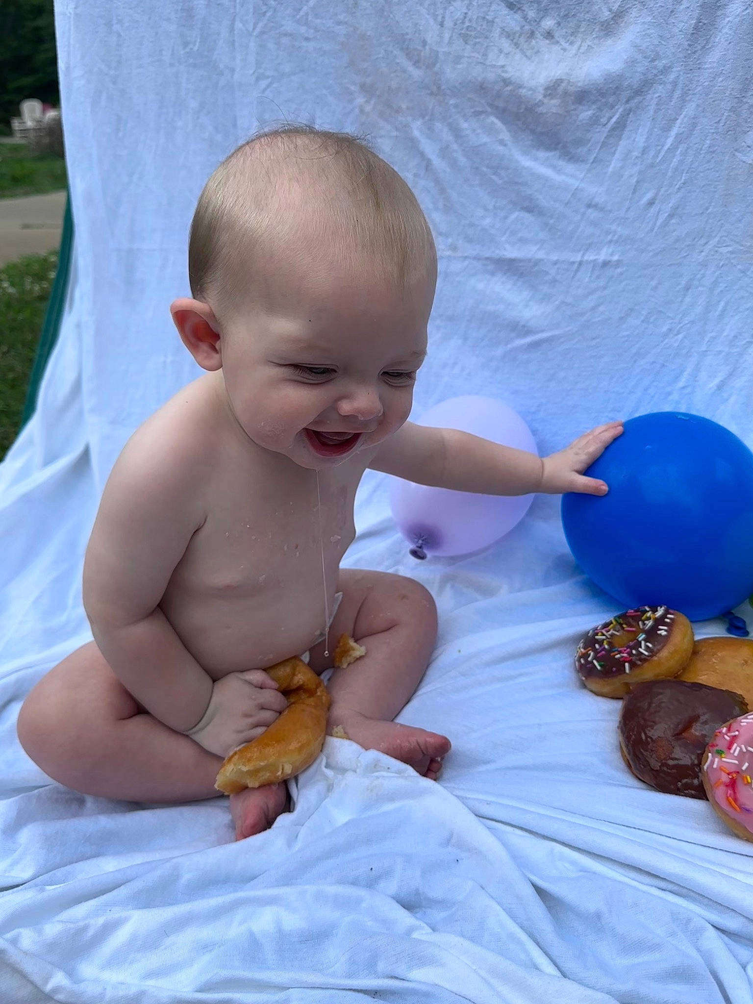 Jett is registered to the contest to win money with this photo: abdomen, baby, baby_toddler_clothing, balloon, beauty, child, event, finger, fun, hairstyle, happy, joint, mammal, organ, person, sitting, skin, smile, thumb, toddler