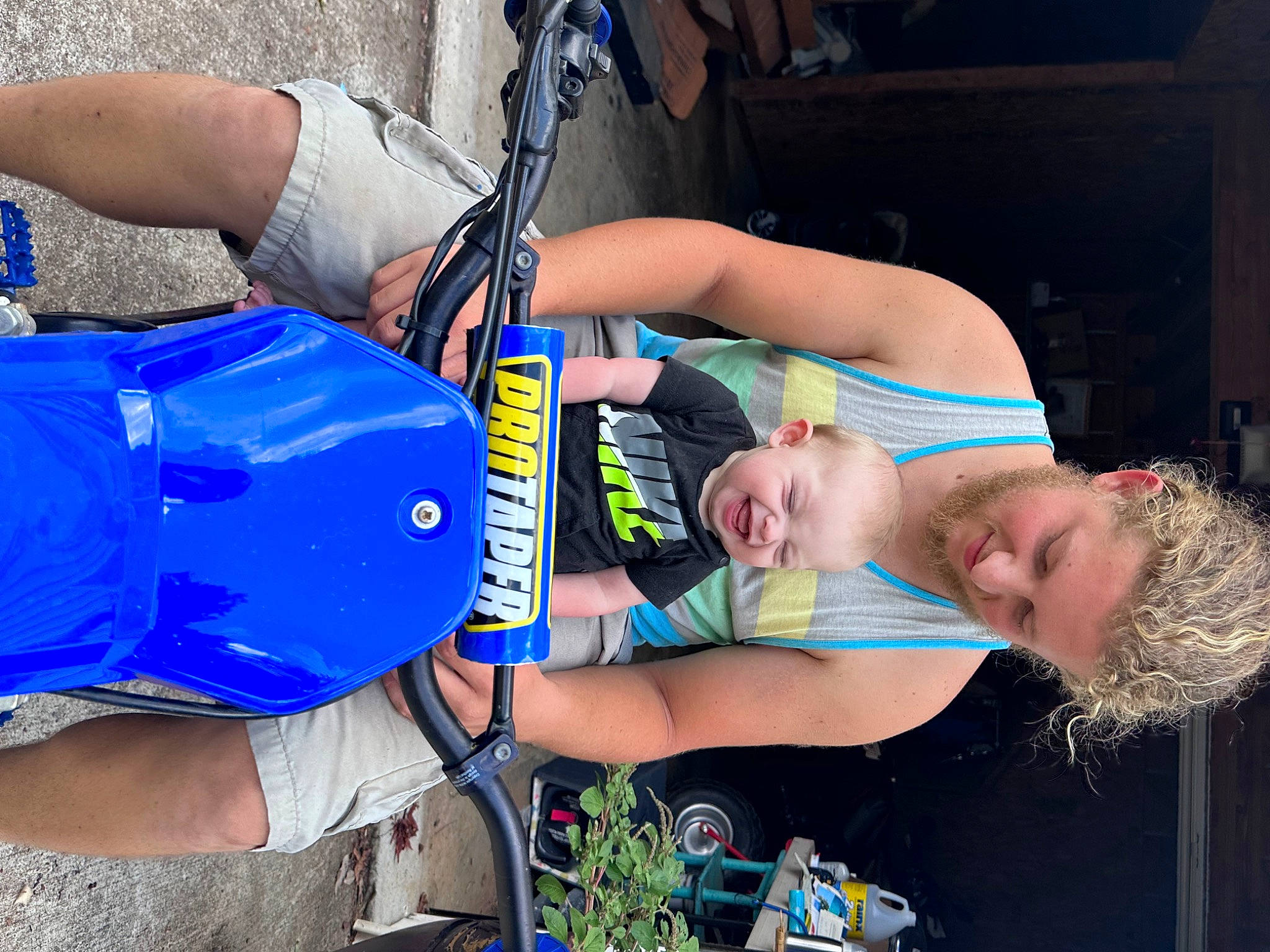 Jett is registered to the contest to win money with this photo: baby_products, blue, child, elbow, electric_blue, event, fun, human_leg, joy, knee, leisure, person, personal_protective_equipment, plant, recreation, shorts, t_shirt, thigh, vacation, wrist