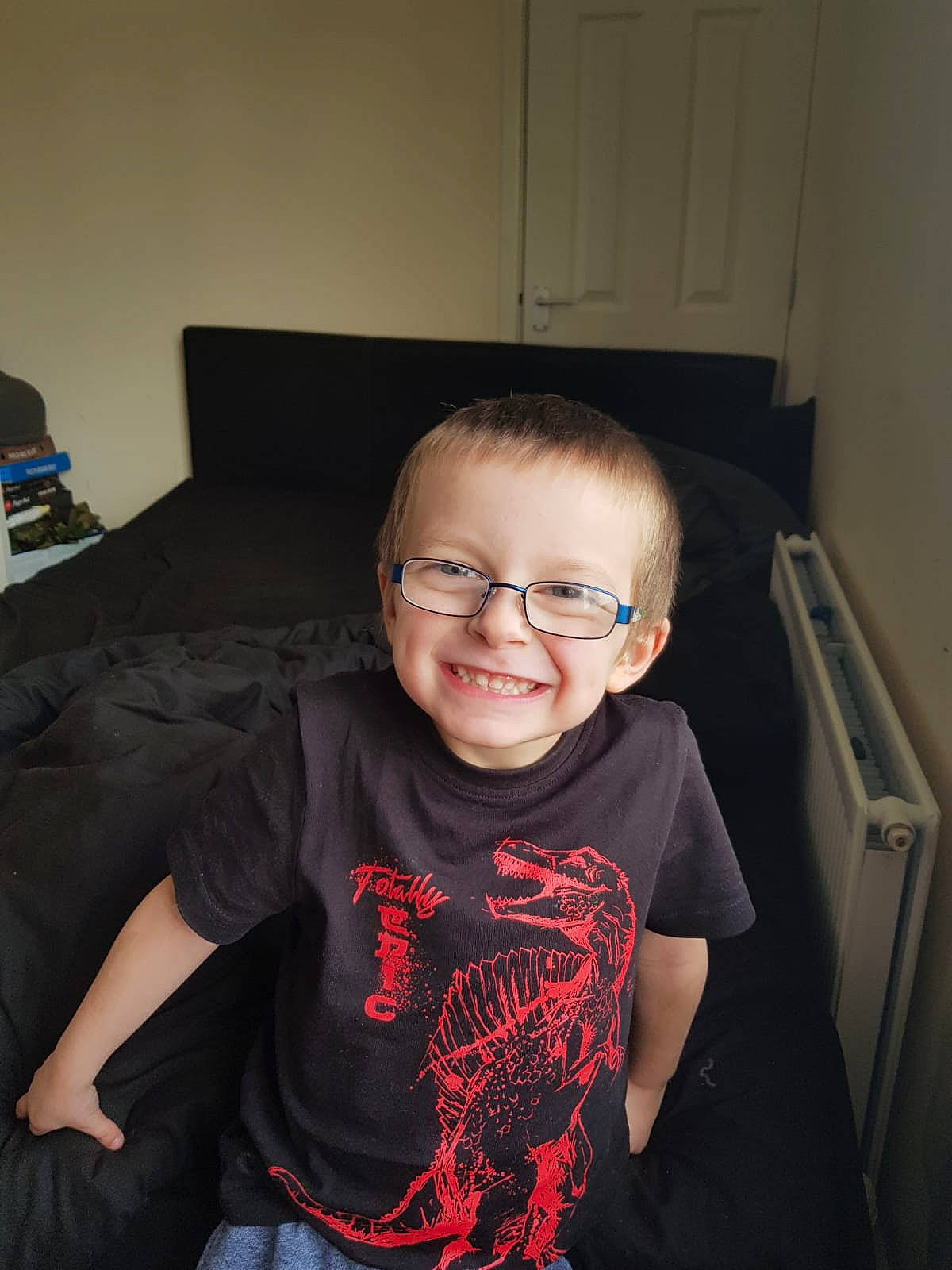 Tyla-jay is registered to the contest to win money with this photo: boy, child, cool, day, eye, eyewear, fun, girl, glasses, hair, hairstyle, joy, organ, outerwear, person, product, sitting, smile, t_shirt, toddler