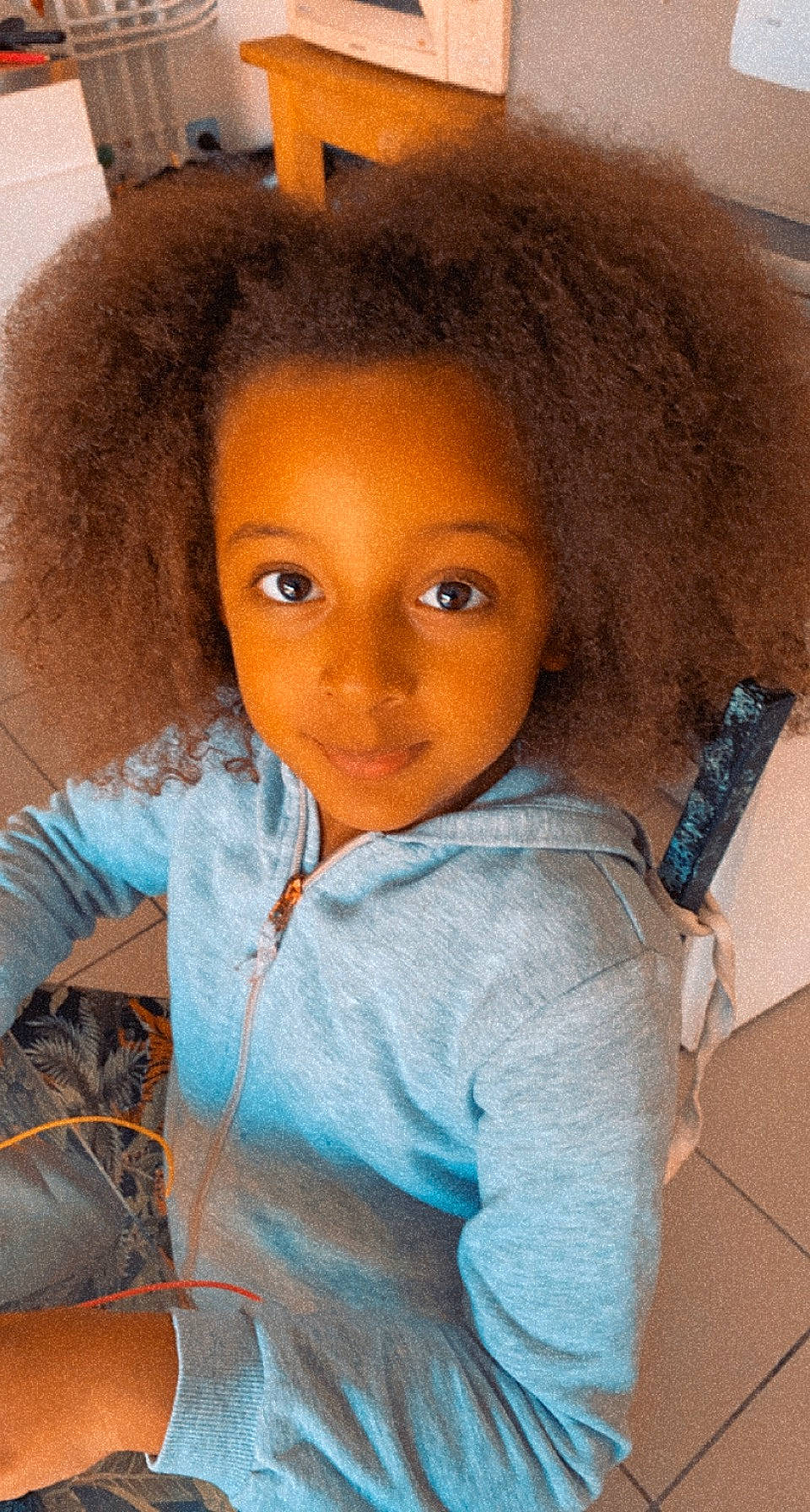 Salomé participe au concours pour gagner de l'argent avec cette photo : afro, black_hair, cheek, chin, cool, doll, eyebrow, forehead, hair, head, iris, jheri_curl, lip, neck, nose, outerwear, person, skin, sleeve, t_shirt