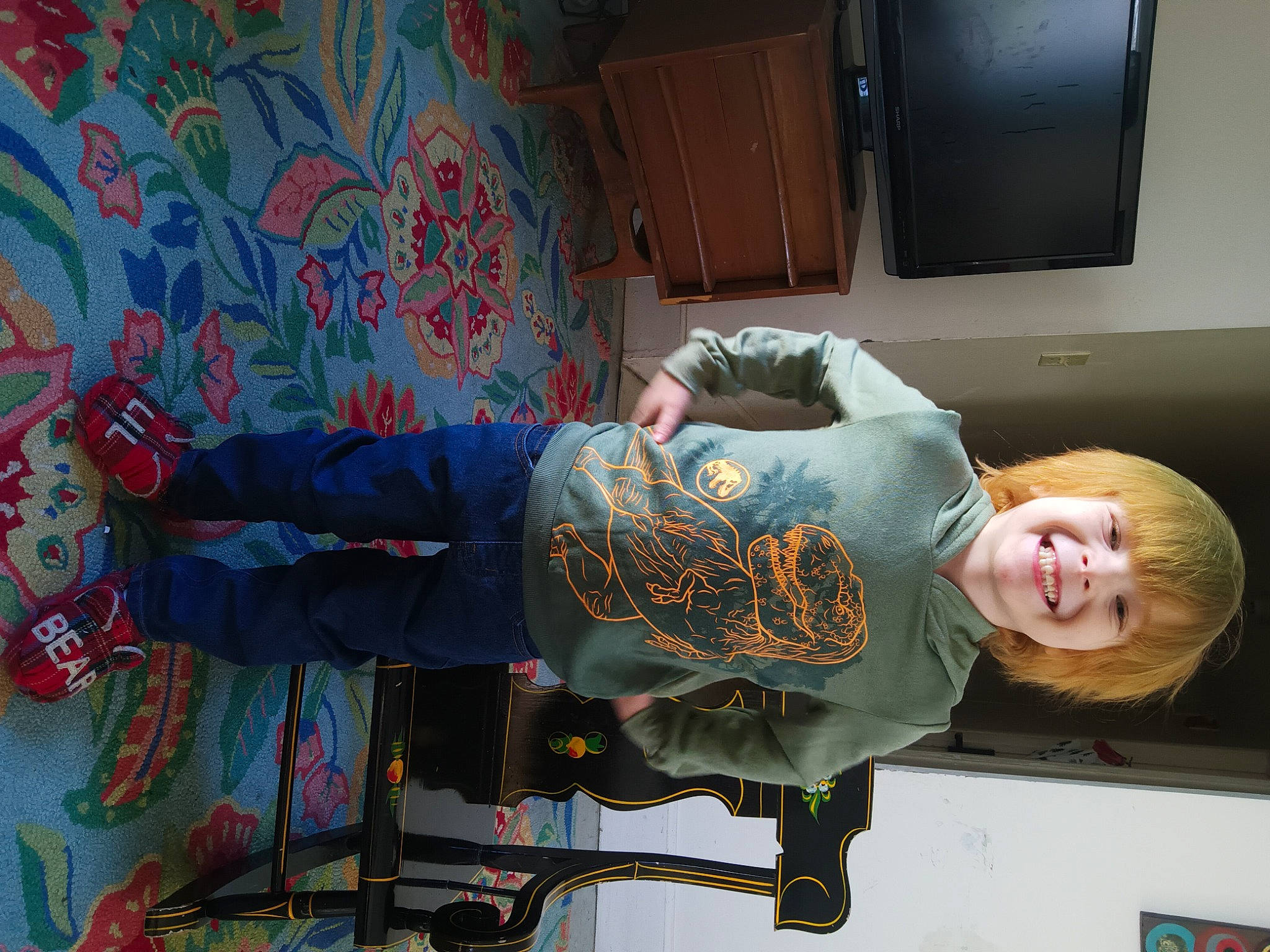 Levi is registered to the contest to win money with this photo: art, artist, cabinetry, comfort, elbow, flooring, fun, home_appliance, joy, kitchen_appliance, person, room, sitting, smile, television, visual_arts