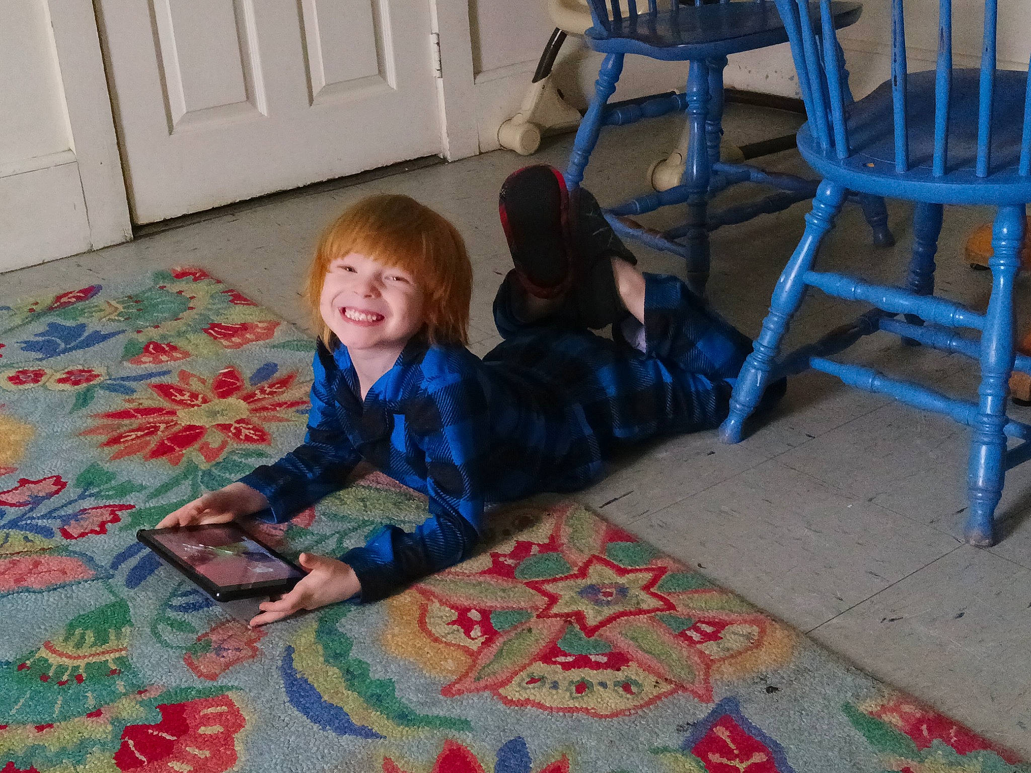 Levi joined the competition — help win amazing prizes! blue, cabinetry, carpet, child, comfort, electric_blue, floor, flooring, fun, hardwood, jacket, joint, joy, leisure, pattern, person, room, sitting, smile, textile