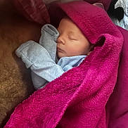 Elliot is registered to the contest to win money with this photo: baby, sleeping, blanket, pink, cozy, infant, soft, clothing, closeup, toddler, child, resting, warm, portrait, indoors, cute, peaceful, wrapped, newborn, face