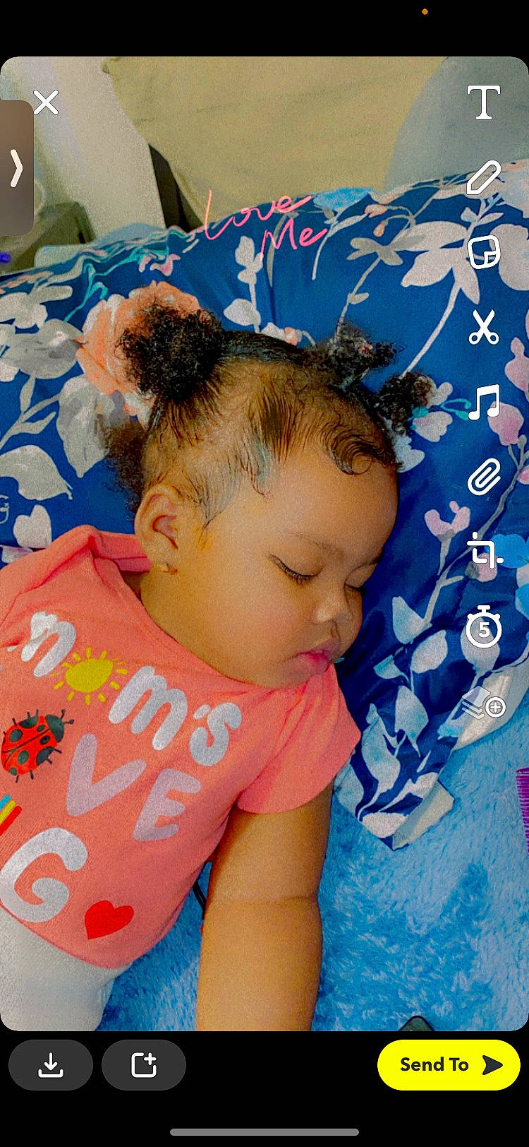 Karmella is registered to the contest to win money with this photo: azure, baby, baby_toddler_clothing, blue, child, comfort, electric_blue, fun, hair, hairstyle, happy, head, leisure, linens, pattern, person, room, sleeve, t_shirt, textile