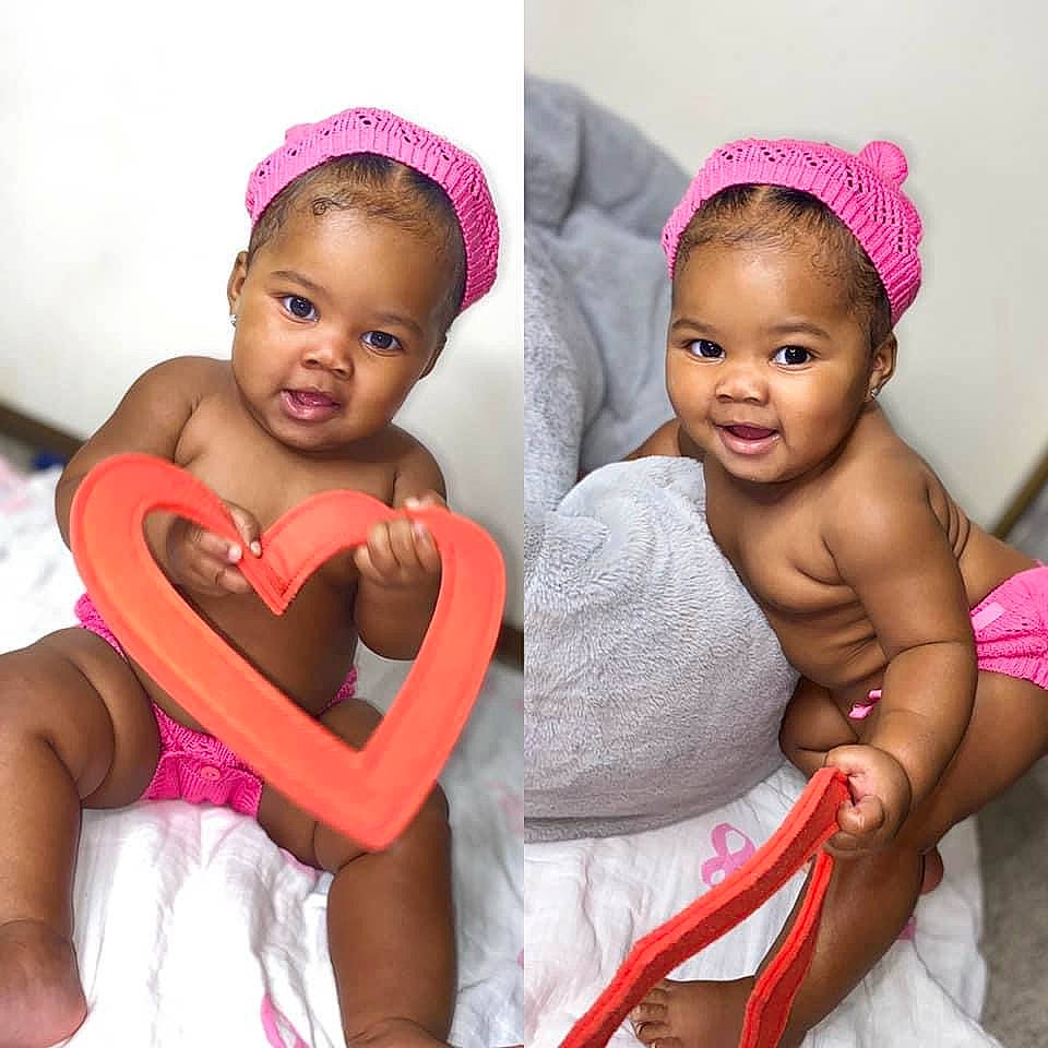 Karmella is registered to the contest to win money with this photo: baby, baby_toddler_clothing, black_hair, comfort, dress, eye, facial_expression, fashion, finger, hairstyle, happy, headgear, human, lip, muscle, neck, people, person, pink, skin