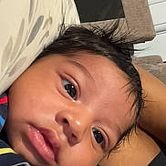 Kahryee joined the competition — help win amazing prizes! baby, infant, child, face, person, striped_clothing, indoor, couch, pillow, closeup, skin, hair, expression, video_call, technology, communication, relaxing, young, portrait, casual