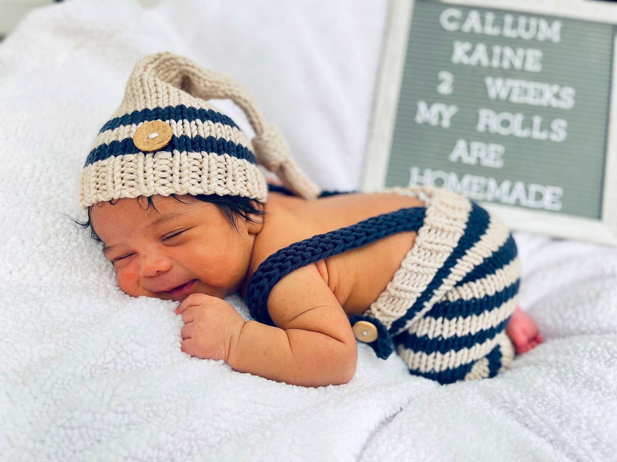 Callum joined the competition — help win amazing prizes! art, baby, baby_products, baby_sleeping, baby_toddler_clothing, cap, child, comfort, finger, font, hand, happy, headgear, headwear, knit_cap, linens, pattern, person, skin, toddler