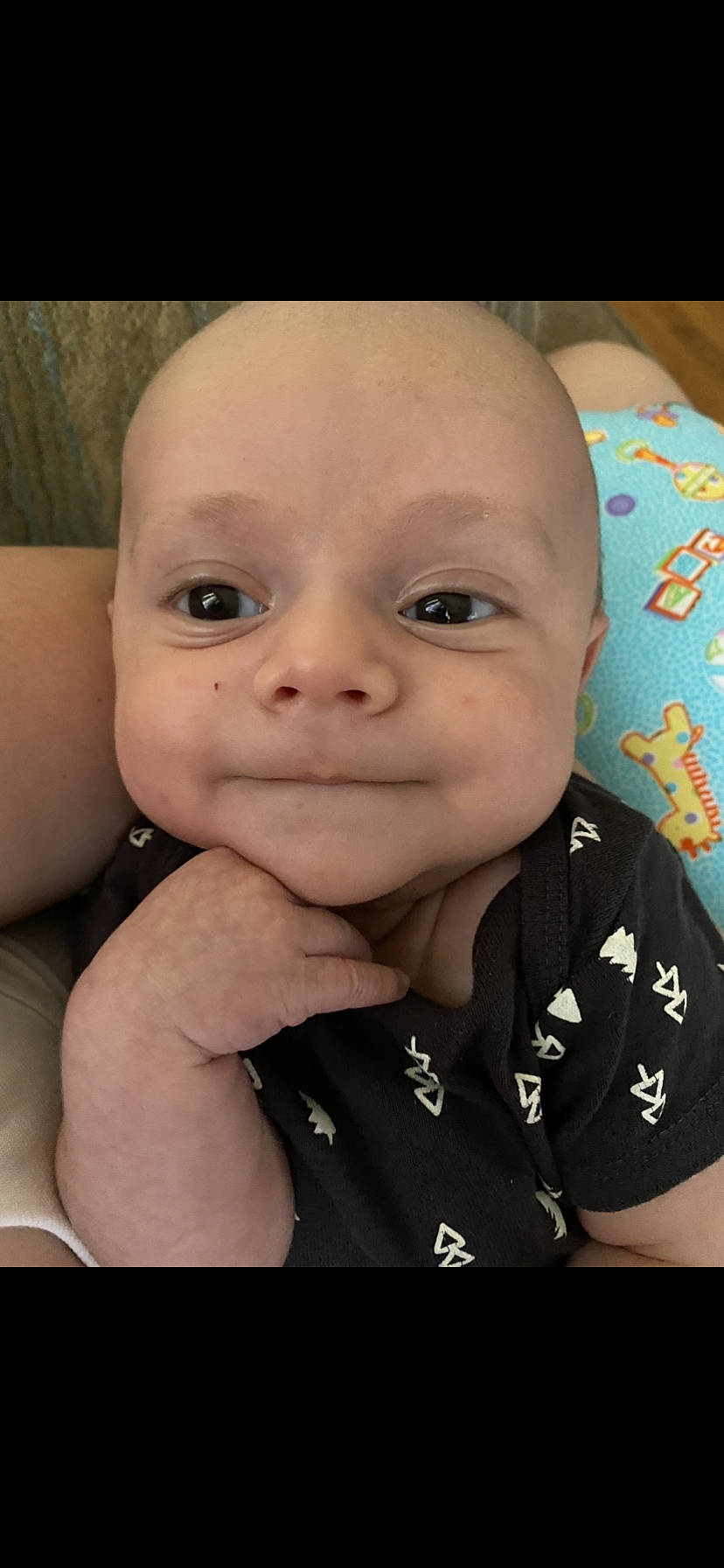Jaxtyn is registered to the contest to win money with this photo: arm, baby, cheek, chin, eye, eyebrow, eyelash, face, facial_expression, forehead, gesture, happy, head, human, iris, joy, lip, mouth, nose, person