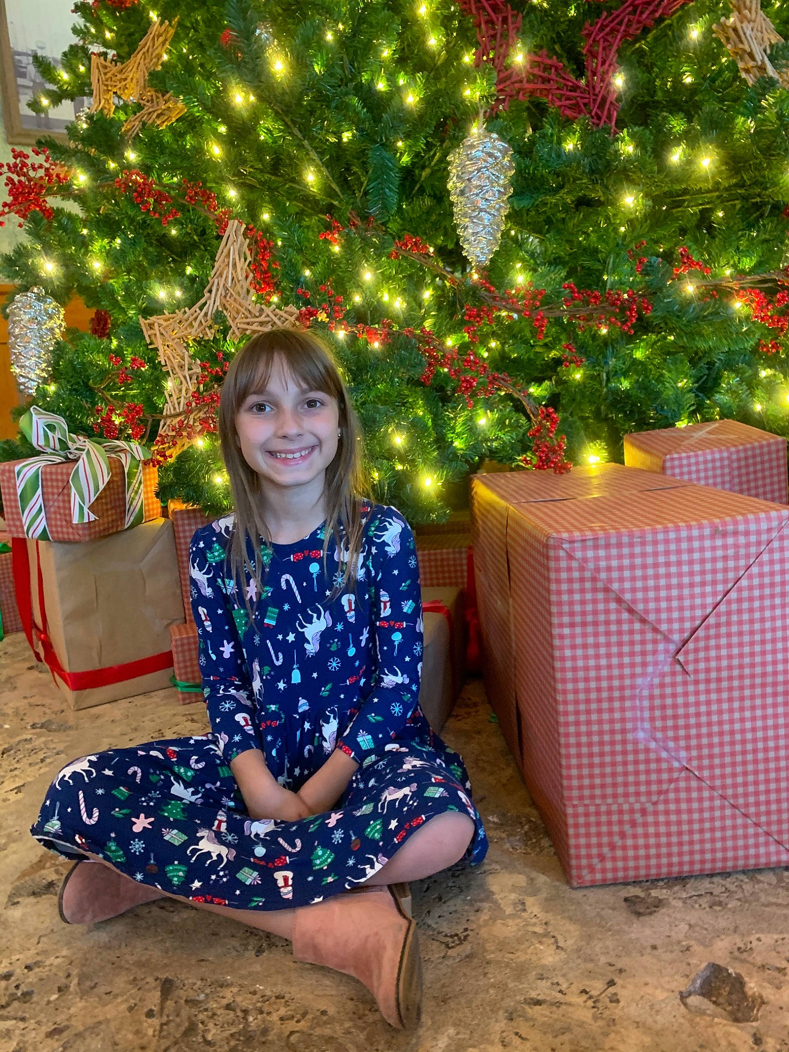 Diana is registered to the contest to win money with this photo: child, christmas, christmas_decoration, christmas_eve, christmas_lights, christmas_ornament, christmas_tree, conifer, event, fir, holiday, holiday_ornament, interior_design, joy, person, pine, pine_family, plant, sitting, spruce