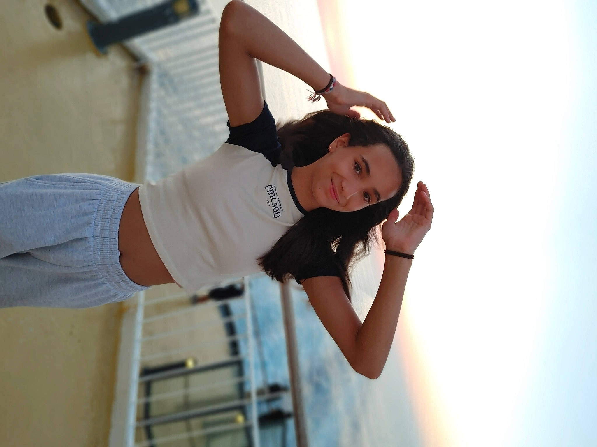 Loona participe au concours pour gagner de l'argent avec cette photo : abdomen, elbow, eyewear, fashion_design, flash_photography, gesture, hand, happy, human_leg, joint, joy, knee, long_hair, person, shoulder, sleeve, standing, t_shirt, thigh, trunk