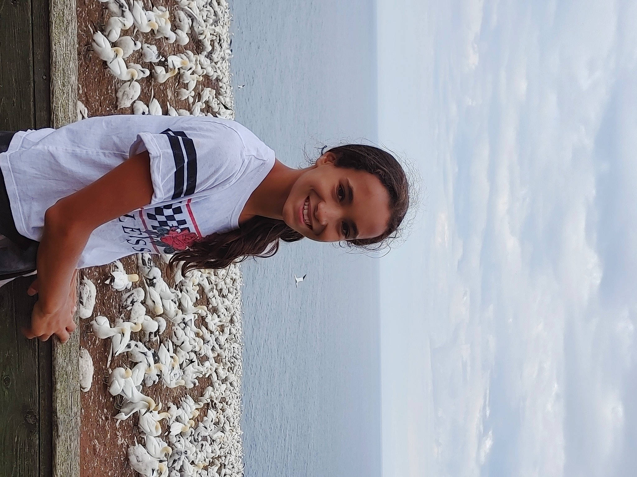 Naomi participe au concours pour gagner de l'argent avec cette photo : arm, beach, child, cloud, elbow, fashion_design, flash_photography, freezing, fun, happy, joy, pattern, person, portrait_photography, sky, smile, t_shirt, vacation, waist, water