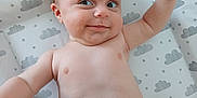 Charley joined the competition — help win amazing prizes! baby, infant, diaper, smile, face, arm, skin, changing_pad, cloud_pattern, stars, lying_down, cute, chubby, expression, indoor, child, person, human, playful, happy