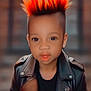 Nyiteeya is registered to the contest to win money with this photo: child, mohawk, orange_hair, leather_jacket, portrait, fashion, cool, young, person, attitude, style, hair, face, eye, mouth, black_clothing, indoor, confident, cute, trendy