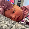 baby, bow, closeup, clothing, comfort, cozy, cute, fabric, face, floral, headband, indoor, newborn, peaceful, person, resting, skin, sleeping, soft, striped