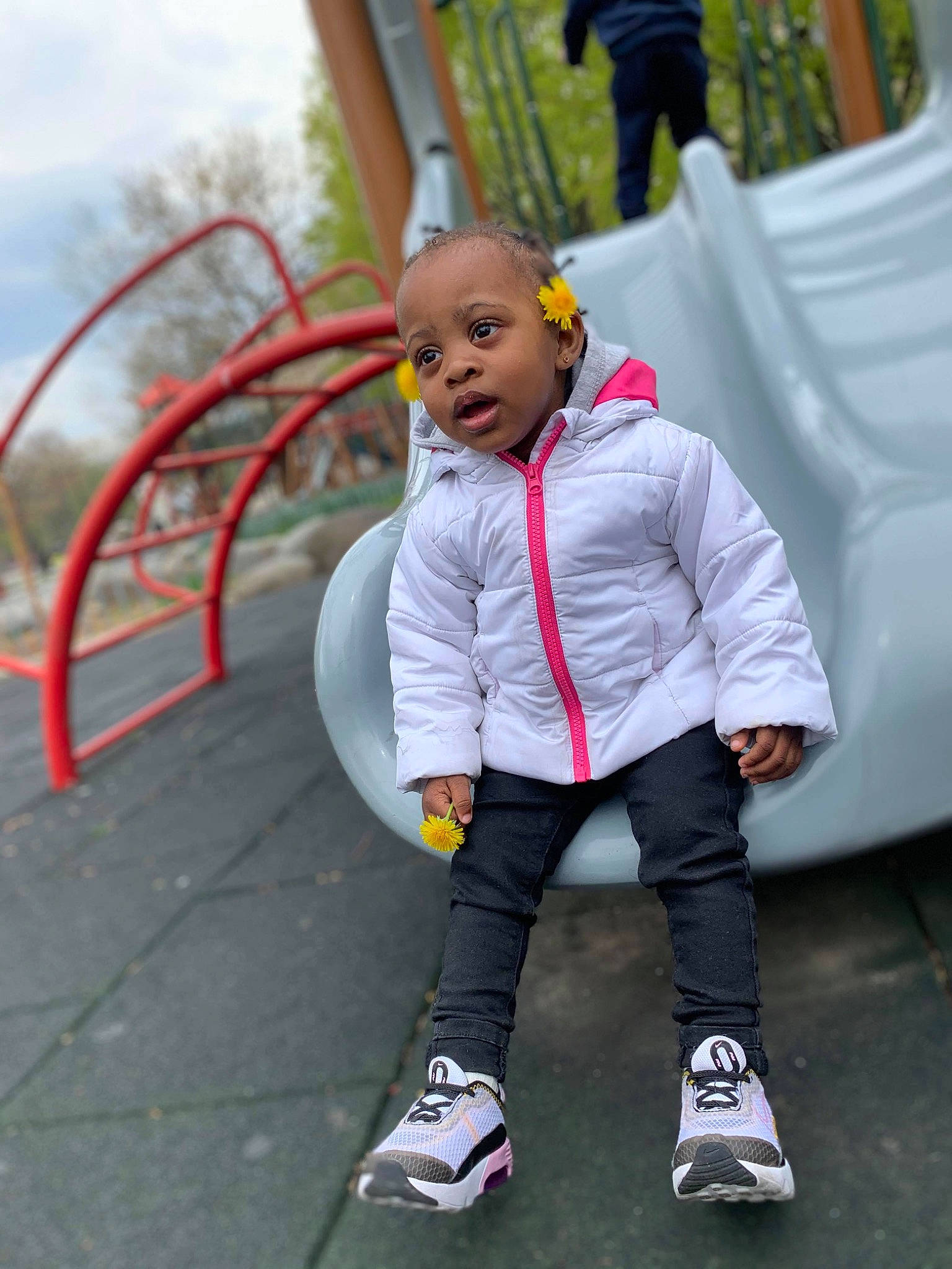 Kehlani is registered to the contest to win money with this photo: ball, boot, child, city, fun, grass, happy, hoodie, leisure, pedestrian, person, play, recreation, sitting, sky, street, toddler, tree, vacation