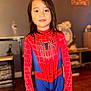 Raiteva participe au concours pour gagner de l'argent avec cette photo : blue, child, childhood, costume, cute, face, fun, home, indoor, kid, long_hair, looking_at_camera, person, portrait, red, smiling, spiderman_costume, standing, superhero, young