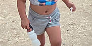 Valeriah joined the competition — help win amazing prizes! child, toddler, outdoor, walking, water_bottle, pink_shoes, tank_top, shorts, dirt_path, ground, daylight, casual_clothing, young_child, person, bare_legs, summer_clothes, playful, nature, active, cute