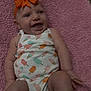 baby, infant, smile, headband, bow, onesie, patterned_clothing, pink_blanket, soft_texture, happy, lying_down, cute, chubby_arms, chubby_legs, indoor, child, person, closeup, skin, baby_girl