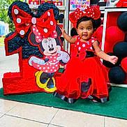 Yeilin Hisel Madrid is registered to the contest to win money with this photo: architecture, baby, balloon, building, clothing, costume, dress, face, footwear, formalwear, grass, hat, head, people, person, photography, plant, portrait, shoe, skirt