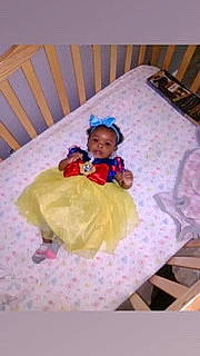 Angelica joined the competition — help win amazing prizes! baby, baby_products, baby_toddler_clothing, bedding, child, comfort, face, flooring, fun, linens, magenta, pattern, person, play, rectangle, room, sitting, sleeve, textile, toddler