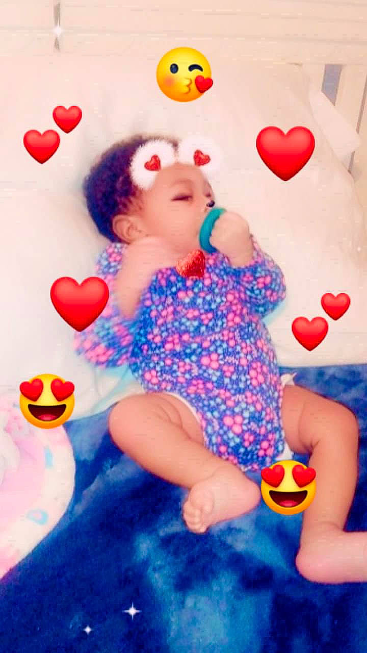 Angelina is registered to the contest to win money with this photo: arm, baby_toddler_clothing, balloon, child, finger, fun, gesture, happy, leisure, magenta, nail, orange, organ, pattern, people, person, pink, red, skin, toddler