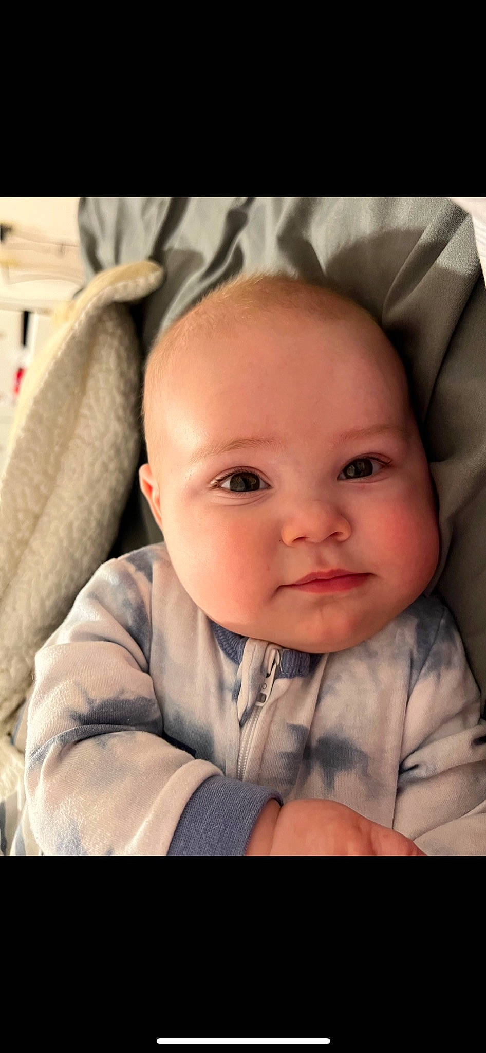 Tatum is registered to the contest to win money with this photo: baby, baby_toddler_clothing, beauty, cheek, child, comfort, eyebrow, eyelash, flash_photography, happy, iris, linens, lip, mouth, nose, person, sitting, skin, sleeve, smile