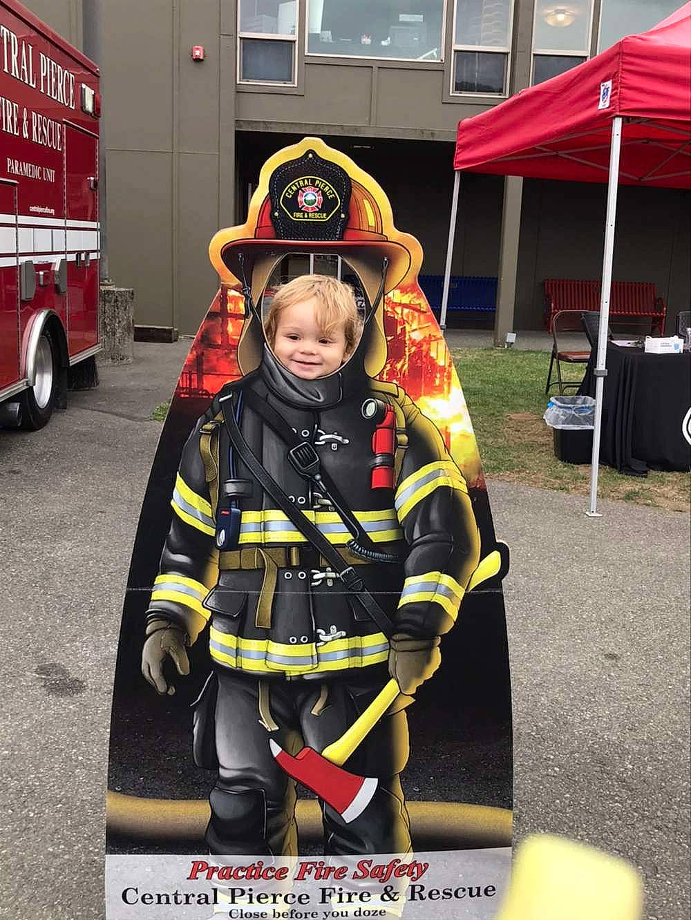 Bodie joined the competition — help win amazing prizes! automotive_tire, emergency_service, event, fire_department, firefighter, helmet, high_visibility_clothing, jacket, joy, motor_vehicle, person, personal_protective_equipment, rescuer, service, smile, tent, tire, vehicle, wheel, window