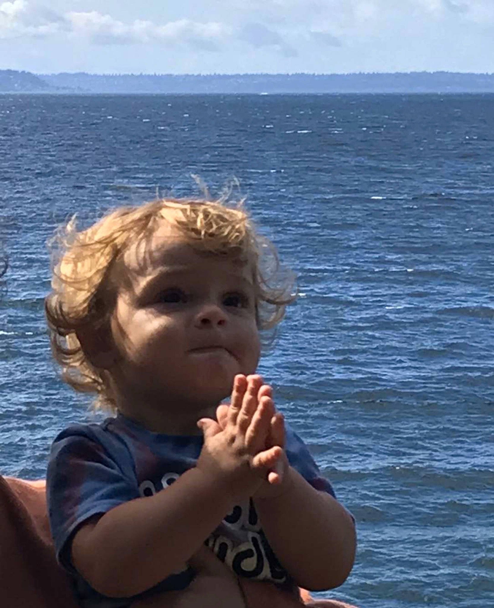 Bodie is registered to the contest to win money with this photo: arm, azure, child, chin, cloud, daytime, eye, flash_photography, fun, gesture, happy, head, human, lake, leisure, mammal, person, sky, toddler, vertebrate