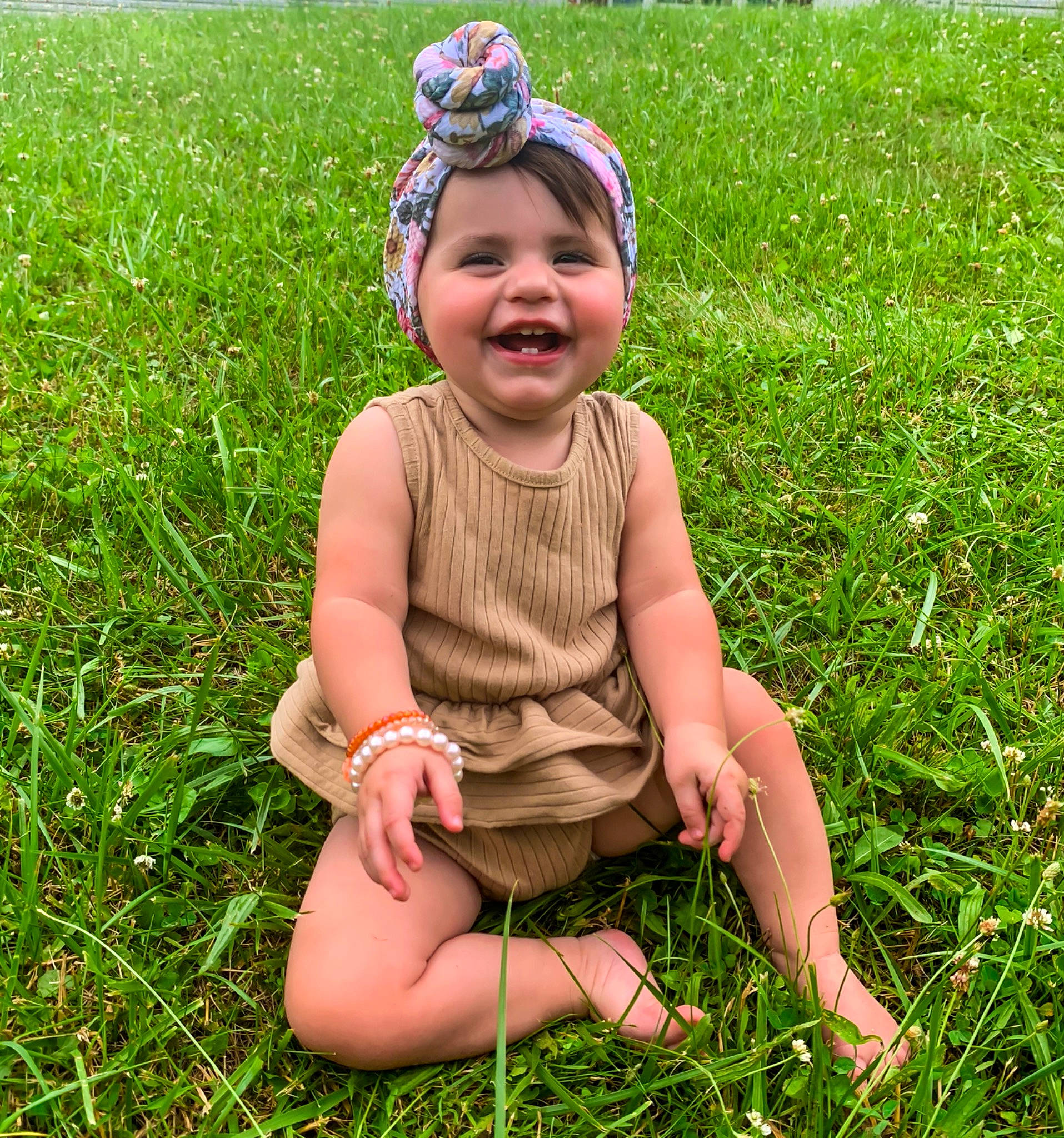 Analeigh joined the competition — help win amazing prizes! baby, baby_toddler_clothing, child, face, grass, grass_family, grassland, groundcover, happy, hat, headwear, joy, lawn, leaf, meadow, people_in_nature, person, plant, shorts, smile