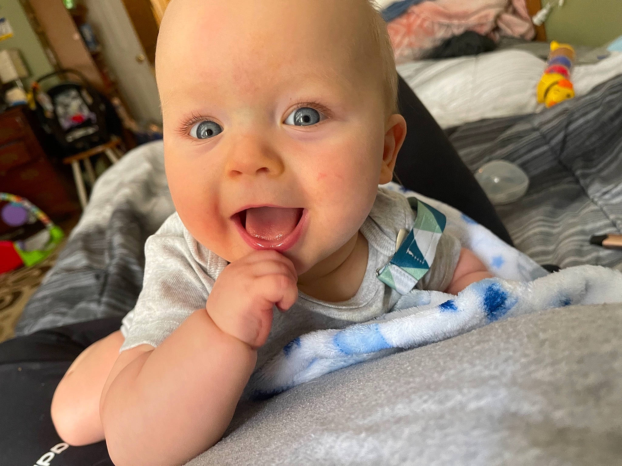 Emmett joined the competition — help win amazing prizes! baby, baby_toddler_clothing, biting, cheek, child, comfort, ear, eye, eyelash, finger, gesture, happy, iris, mouth, nose, person, sitting, skin, smile, thumb