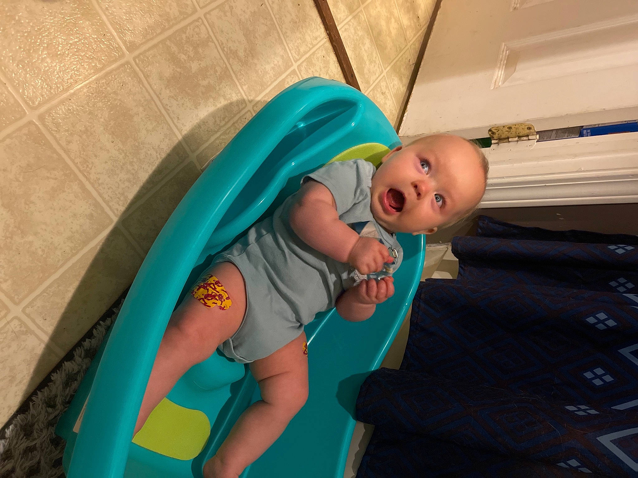 Emmett is registered to the contest to win money with this photo: animation, baby, baby_carriage, baby_products, baby_safety, baby_toddler_clothing, baby_toys, child, comfort, electric_blue, fun, happy, human_body, infant_bed, leisure, linens, person, play, room, skin