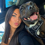 Sanka participe au concours pour gagner de l'argent avec cette photo : woman, dog, selfie, car, harness, smiling, happy, blue_eyes, long_hair, portrait, sunlight, pets, closeup, vehicle_interior, tongue_out, casual, joyful, daylight, friendship, outdoor_view