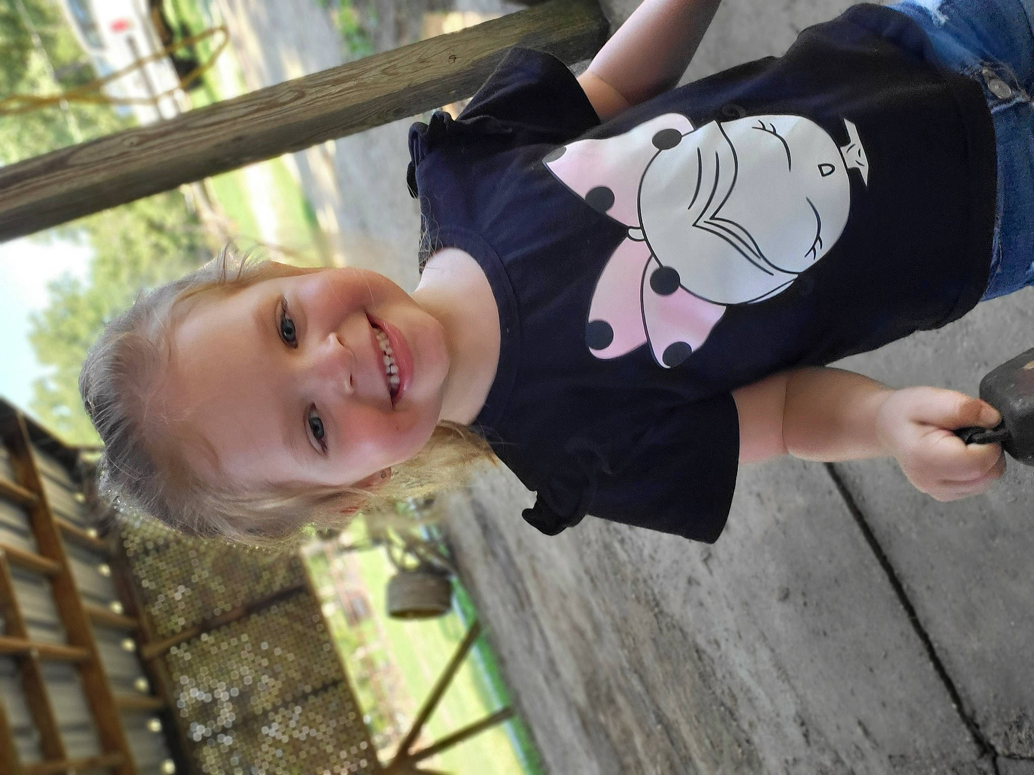 Dixie joined the competition — help win amazing prizes! baseball_cap, cap, child, elbow, fence, fun, gesture, grass, happy, hat, joy, leisure, person, plant, recreation, sleeve, smile, t_shirt, toddler, tree