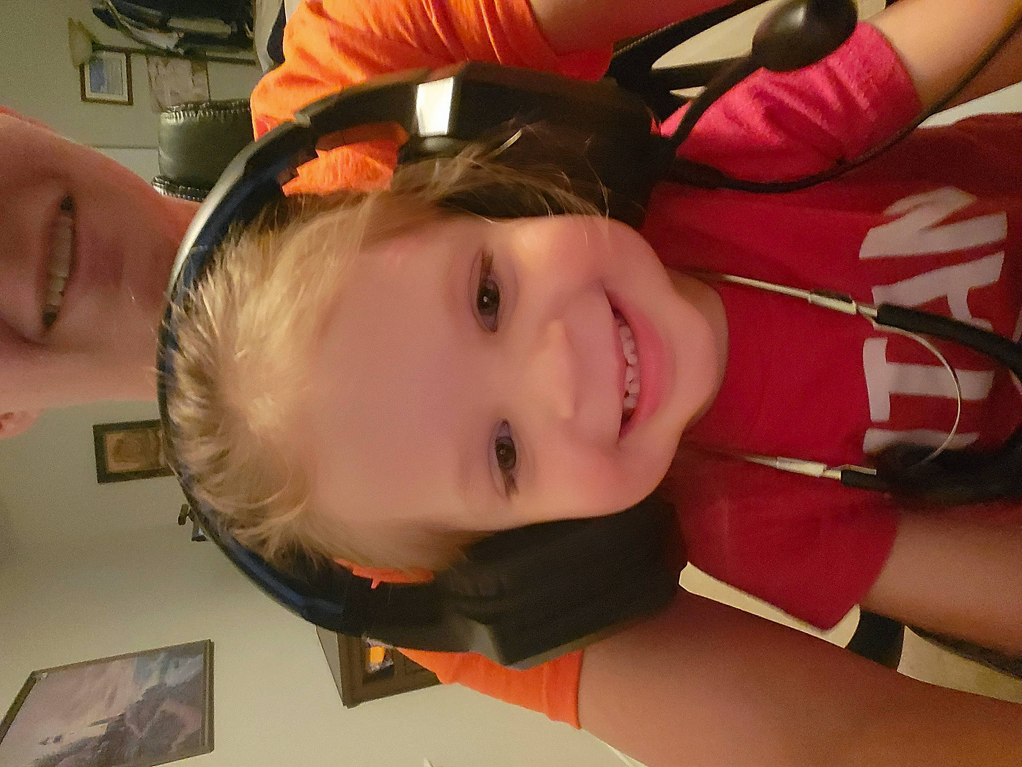 Dixie is registered to the contest to win money with this photo: arm, carmine, cheek, child, eyelash, fun, gesture, human_leg, joy, lip, mouth, nail, nose, person, personal_protective_equipment, skin, smile, thigh, toddler, uniform