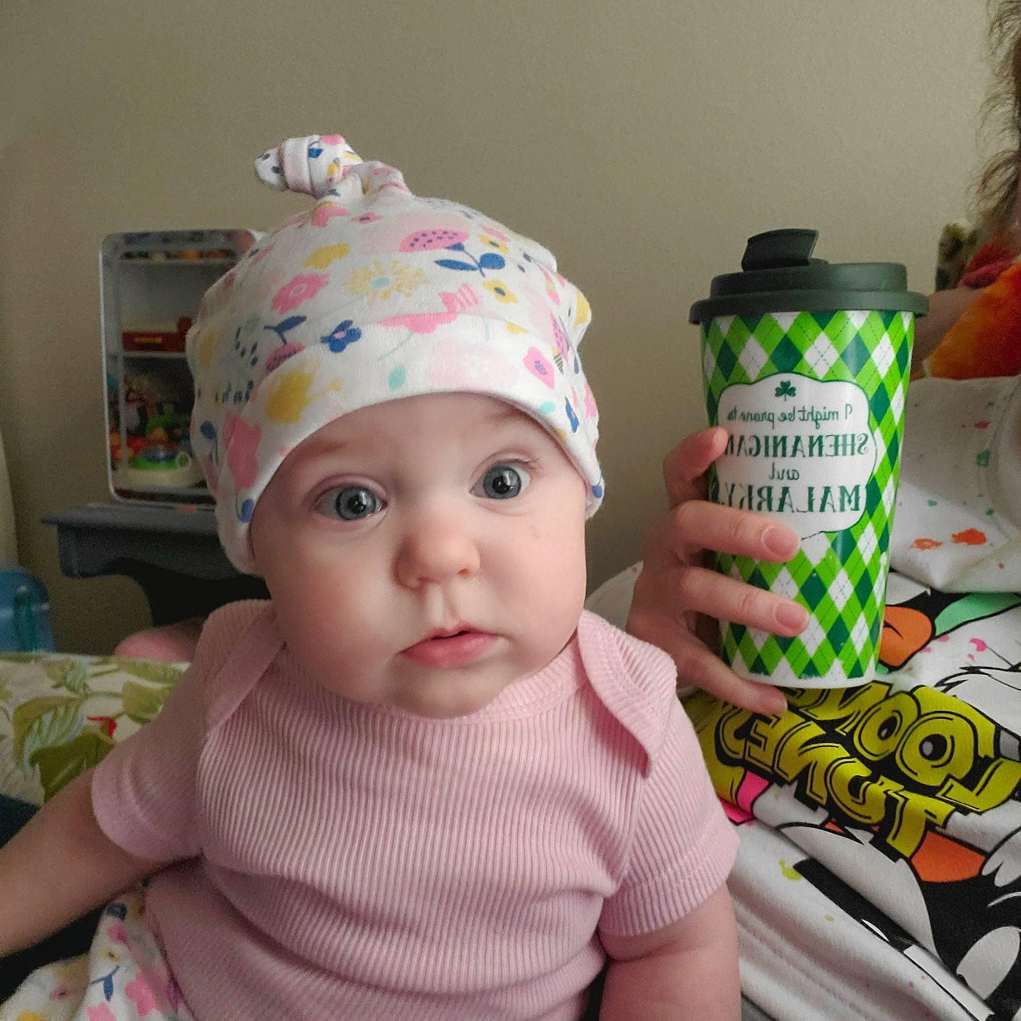 Bonnie joined the competition — help win amazing prizes! baby, baby_products, baby_safety, baby_toddler_clothing, beanie, cap, cheek, child, costume_hat, drinkware, fashion_accessory, fun, headwear, knit_cap, lid, party_supply, person, room, sleeve, toddler