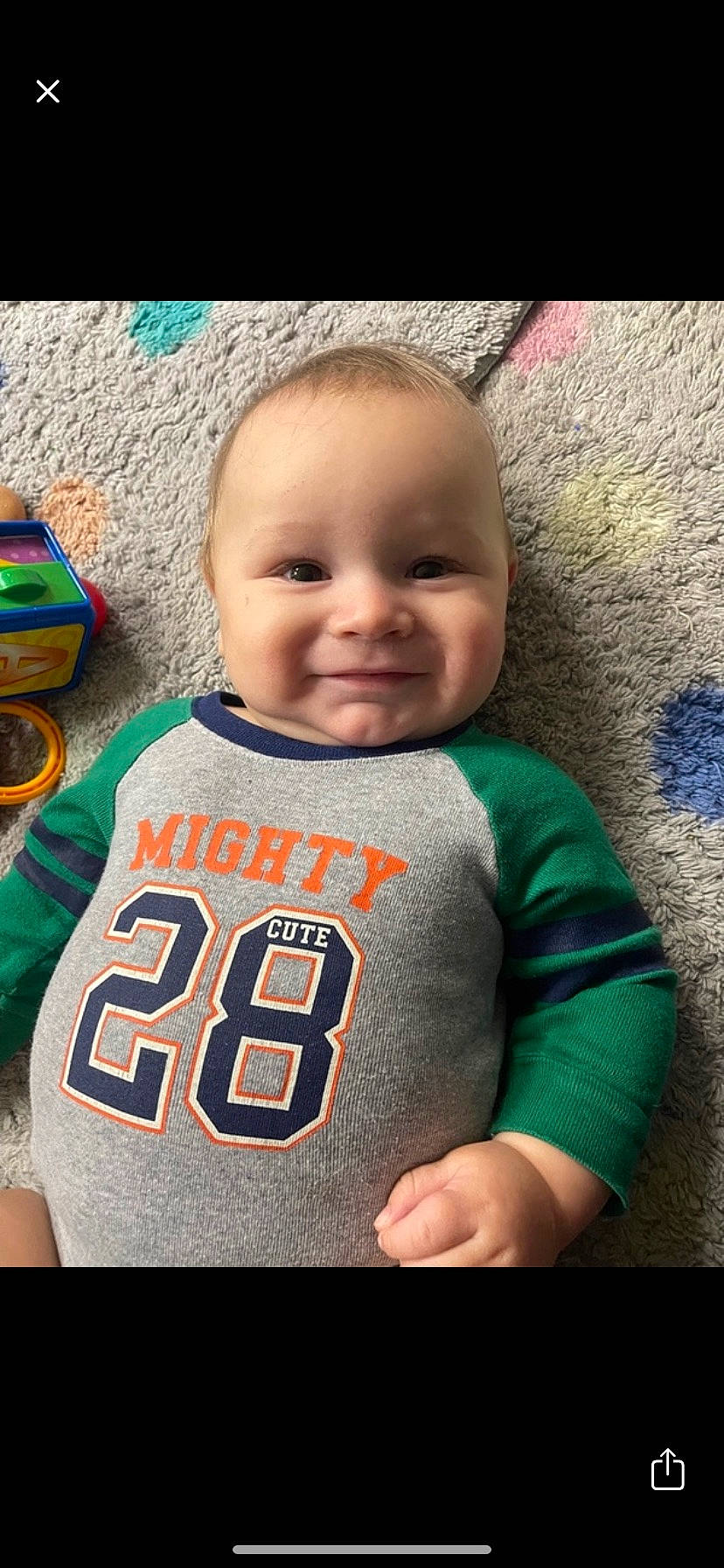 Jackson is registered to the contest to win money with this photo: baby, baby_toddler_clothing, cheek, chin, clothing, cool, face, facial_expression, gesture, happy, jersey, joy, lip, mouth, nose, organ, outerwear, person, sleeve, smile