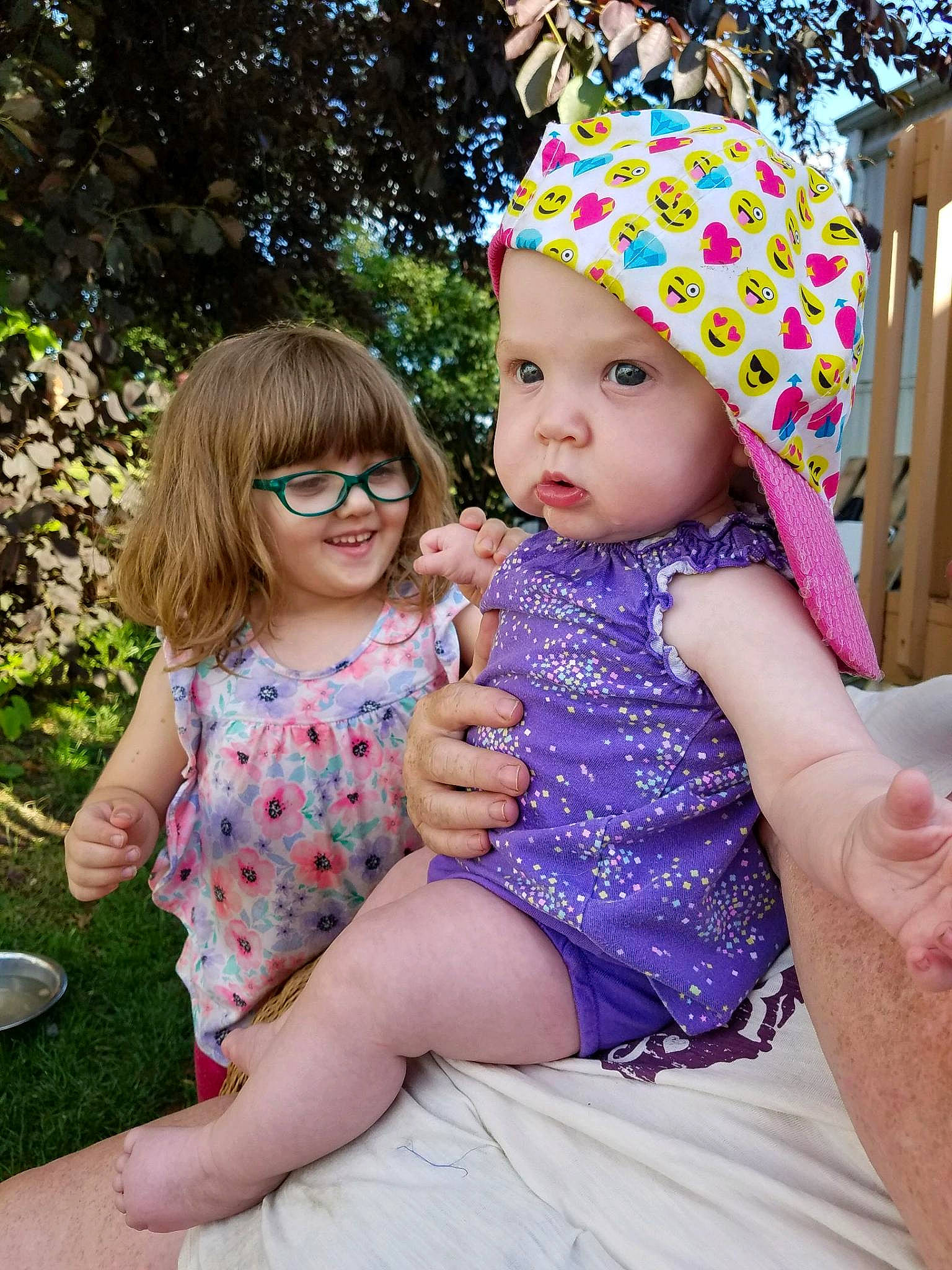 Eretria is registered to the contest to win money with this photo: baby, child, daughter, dress, family, fashion_accessory, fun, hair_accessory, headgear, headwear, joy, pattern, people, person, photography, pink, play, purple, sibling, summer