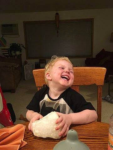 Chaz is registered to the contest to win money with this photo: child, joy, leg, person, play, sitting, smile, toddler, vacation, wood