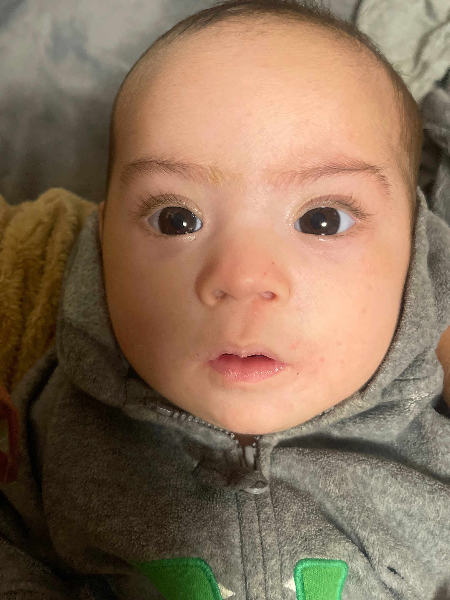Amine joined the competition — help win amazing prizes! baby, face, hoodie, clothing, infant, person, child, portrait, closeup, eyes, skin, expression, cute, young, head, warm, texture, fabric, indoors, soft